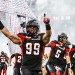 Ottawa-REDBLACKS-Flag-Carrier-credit-Andre-Ringuette